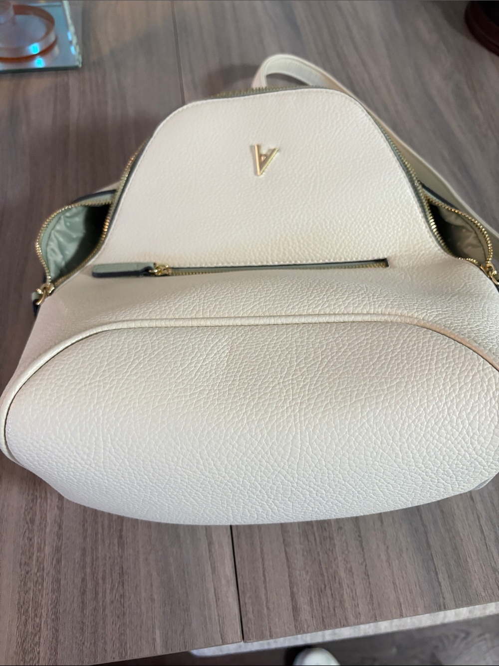 White Pebbled Leather Backpack with Gold V Accent